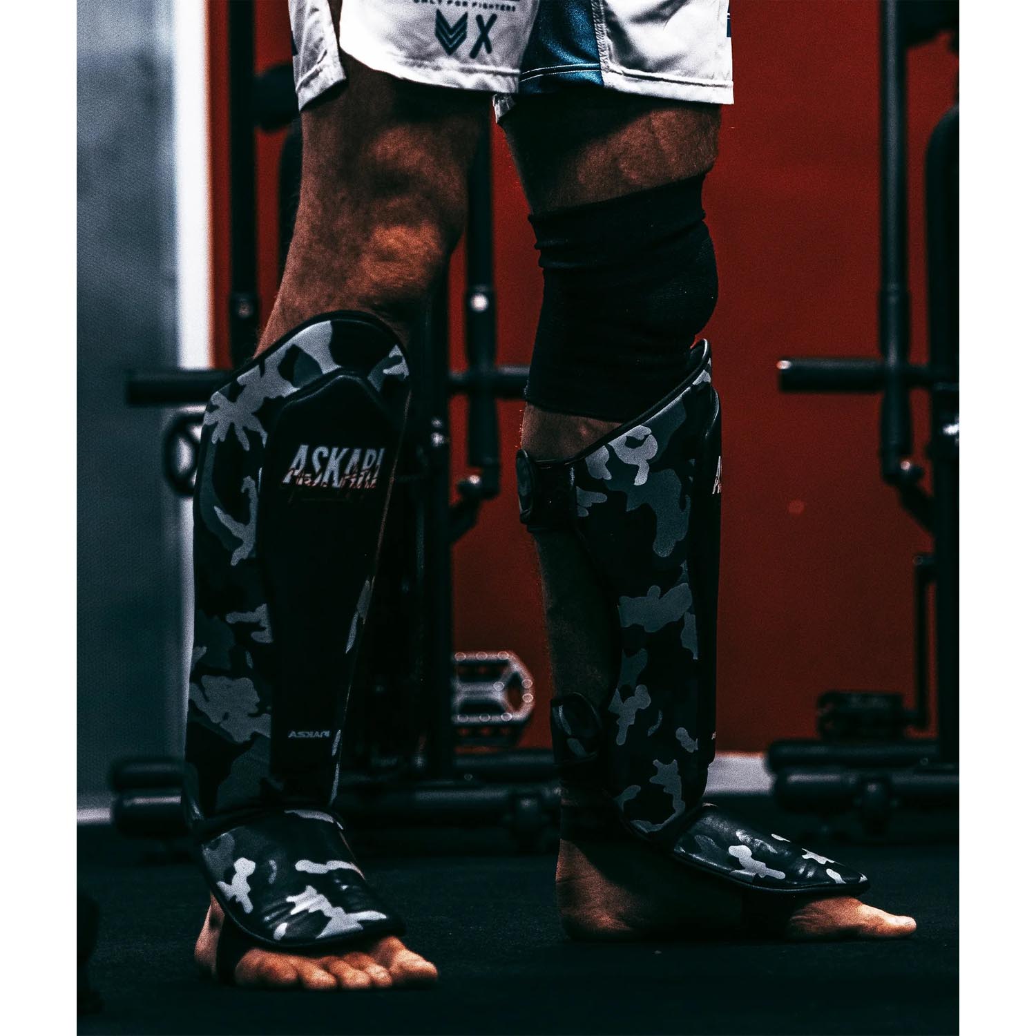 ASKARI Shinguards, Desert, black-camo, XL